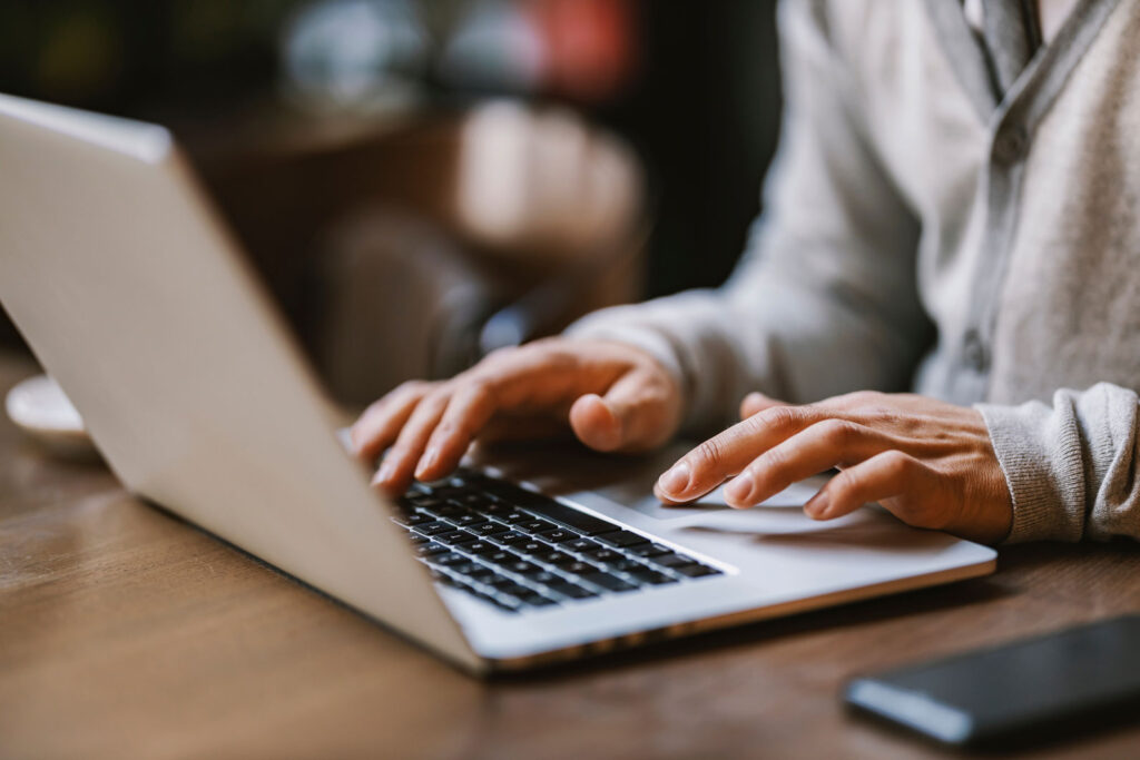 man using laptop to vet an automated appraisal review solution